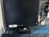 a computer on a desk with a keyboard and mouse