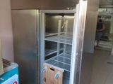 an image of a commercial refrigerator in a kitchen