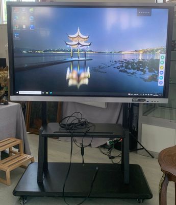 a flat screen tv sitting on a stand in a living room