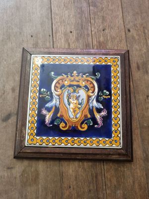 a picture of a tile with a picture of a woman on it