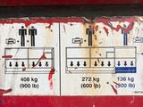 a close up of a sign on the side of a red truck