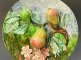 a plate with a painting of fruit and flowers on it