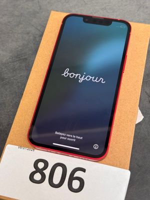 an iphone xr with a box on a table with a price tag on it