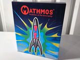 a box with a toy rocket on it on a table