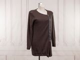 the dress is brown and has a zipper on the front