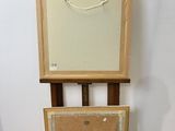 a picture of an easel with a picture on it