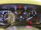 a close up of a car dashboard with a speedometer and gauges