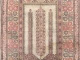 an old rug with an ornate design on it