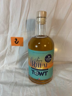 a bottle of rum on a table with a price tag