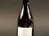 a bottle of wine that is sitting on a table
