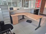 a desk with a chair and a computer on it