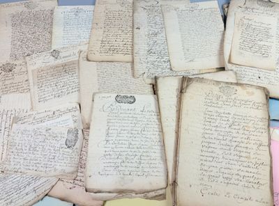 a pile of old papers sitting on top of a table