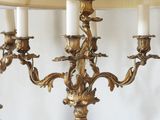 two lamps that are sitting on a table with a lamp on it