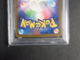 a close up of a pokemon card in a plastic case