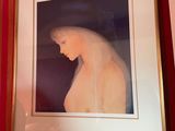 a picture of a woman with a veil hanging on a wall