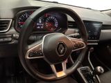 the interior of a car with a steering wheel and dashboard controls