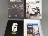 three video games sitting on top of a table next to each other