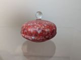 a red and white box sitting on top of a marble counter