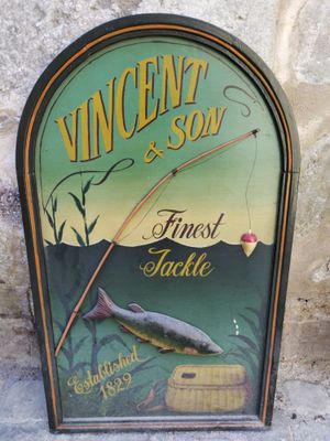 un panneau sur lequel figurent un poisson et une canne à pêche