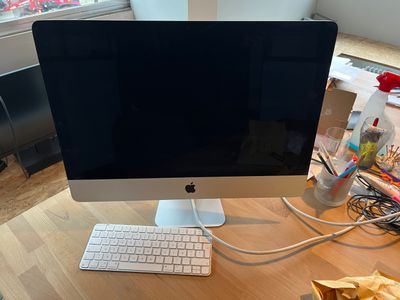 a computer on a desk with a keyboard and mouse