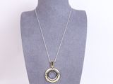a close up of a necklace on a mannequin mannequin