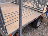 a small trailer with a cage on the back of it