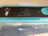 a plastic container with a black and blue label on it