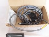 a box with wires and a calculator in it