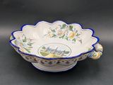 a blue and white bowl with a picture of a castle on it
