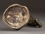 a close up of a bronze figurine of a dog