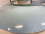 a bowl of soup sitting on a plate on a table