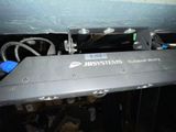 an image of a computer keyboard under a bed