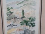 framed watercolor painting of a view of a village in the mountains