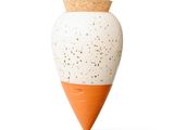 a white and orange vase with a cork top on a white background