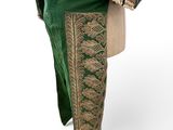 an image of a mannequin wearing a green and gold outfit