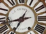 a clock with roman numerals on the face of it