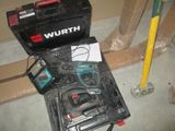 a tool kit that is sitting on the floor next to a tool box