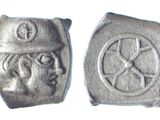 an image of a pair of silver coins with a man ' s face on them