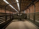 a large room with a lot of stalls inside of it