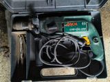a tool in a case that is sitting on the ground