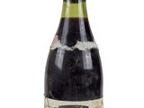 a bottle of wine that is sitting on a table