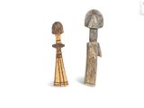 pair of wooden figurines of a man and a woman