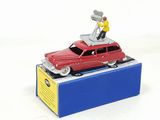 a red toy car with a man on top of it