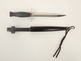 two knives that are laying on a table