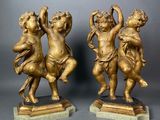 pair of antique bronze figurines of cherenshes on marble bases