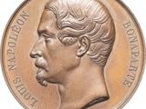 une image représentant une médaille de bronze sur laquelle figure le profil d'un homme
