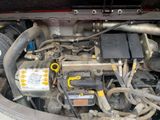 a close up of a car ' s engine with its hood open