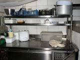 a kitchen with a lot of items on the counter