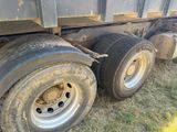 a truck that has a flat tire on the side of it