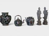 five vases and a teapot sitting next to each other